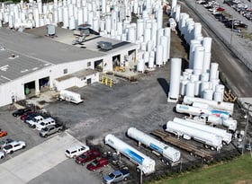 11 - CTR is a TransTech Group Company - photo shows hundreds of vertical cryogenic tanks with a row of cryogenic trailers in front
